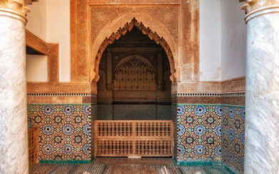 Ornate archway and mosaic tiles in Saadian Tombs, Marrakech.