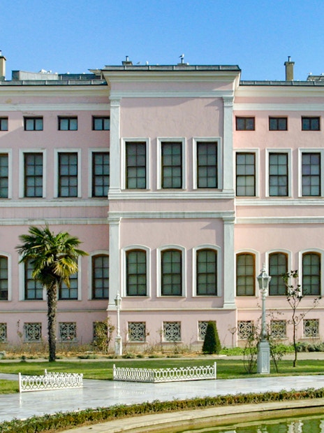 Dolmabahçe Palace Harem exterior with garden view in Istanbul.