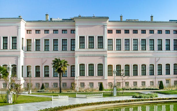 Dolmabahçe Palace Harem exterior with garden view in Istanbul.