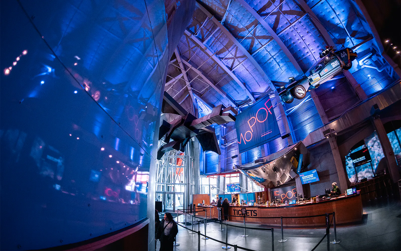 Museum of Pop Culture interior with ticket counter and suspended car, Seattle.