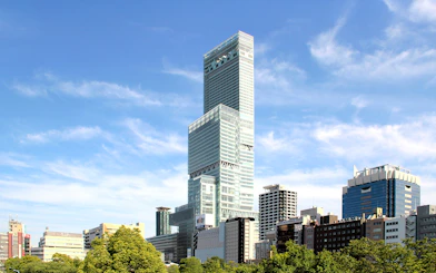 Harukas 300 Observatory building in Osaka, Japan, towering above cityscape.