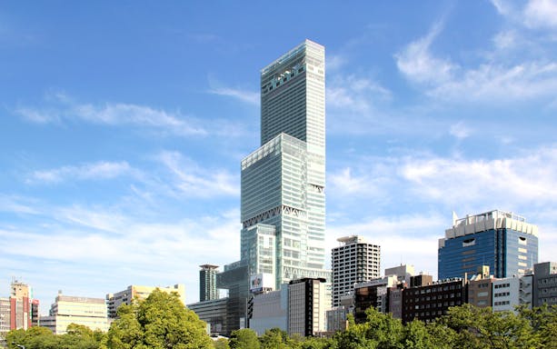 Harukas 300 Observatory building in Osaka, Japan, towering above cityscape.
