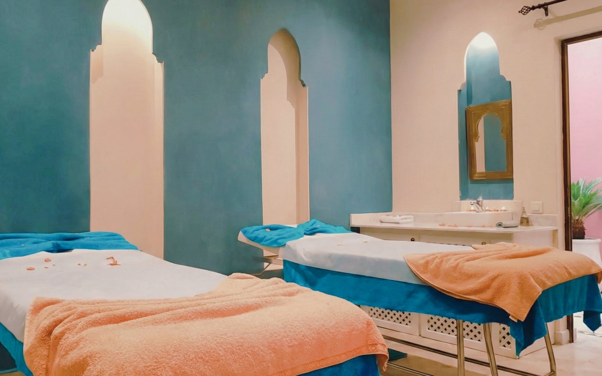 Spa therapy room with massage tables at Traditional Moroccan Steam Hammam, Marrakech.