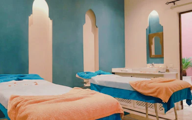 Spa therapy room with massage tables at Traditional Moroccan Steam Hammam, Marrakech.