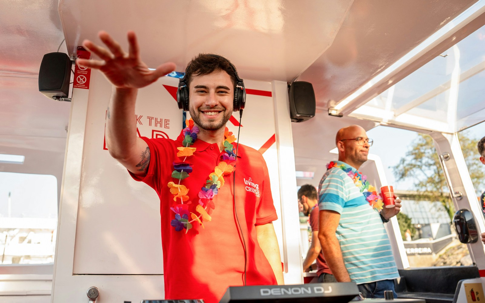 DJ entertaining guests on a Douro River party cruise.