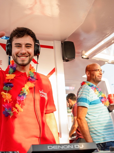 DJ entertaining guests on a Douro River party cruise.
