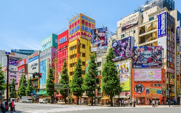 Akihabara street view with colorful anime billboards and buildings in Tokyo.