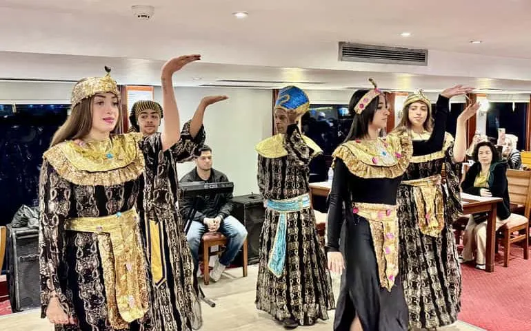 Traditional dancers performing on a Cairo Nile dinner cruise.
