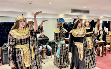 Traditional dancers performing on a Cairo Nile dinner cruise.