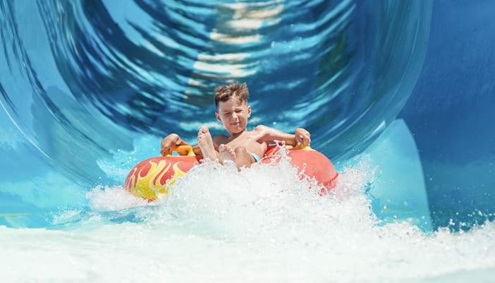 Visitors enjoying water slides at Adventure Waterpark Desaru Coast, Malaysia.