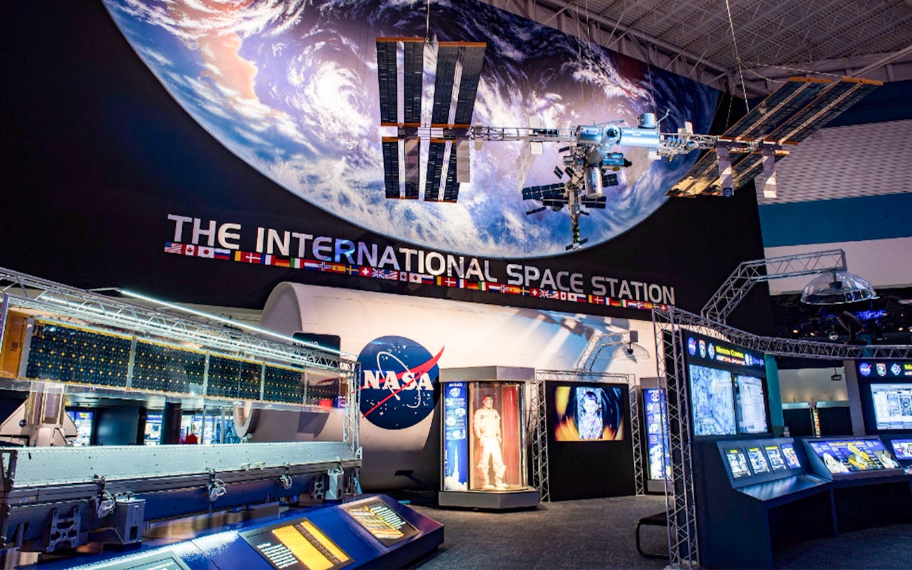 Houston Space Center interior showcasing space exhibits and artifacts.