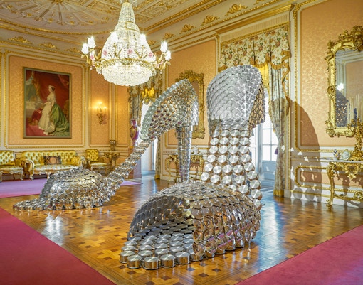 Liria Palace exterior with visitors using audio guides in Madrid, Spain.