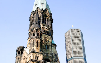 Kaiser Wilhelm Memorial Church and modern tower in Berlin.