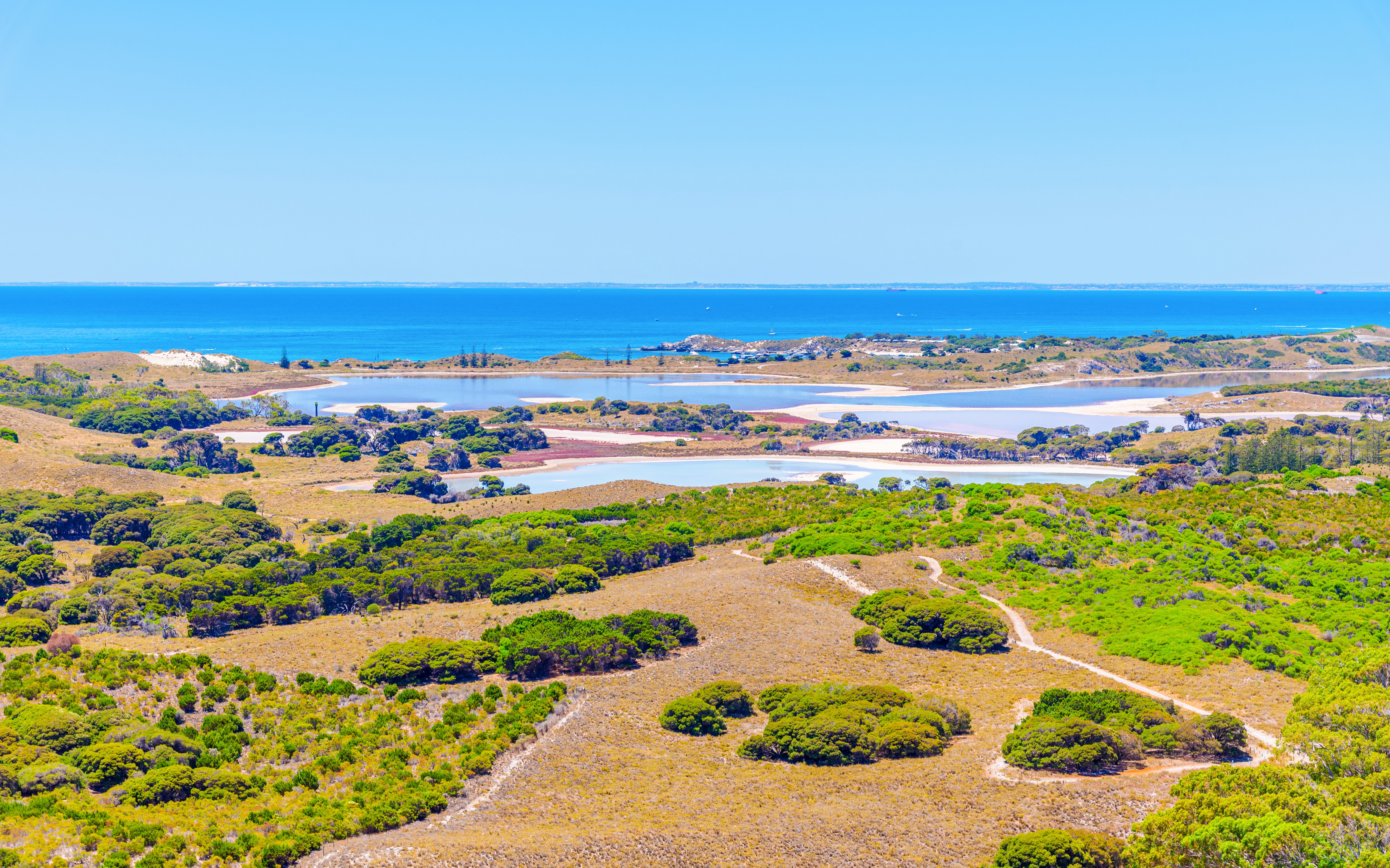 Wadjemup Lighthouse view of Rottnest Island landscape and coastline.