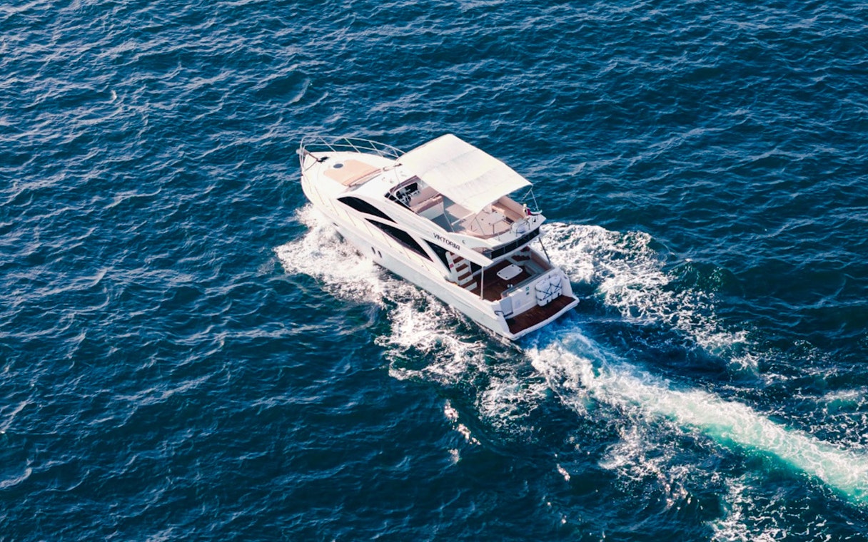 Viktoriia luxury yacht cruising on open sea.