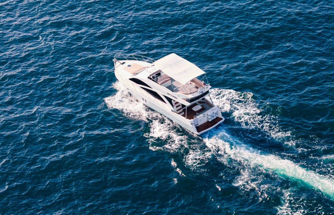 Viktoriia luxury yacht cruising on open sea.