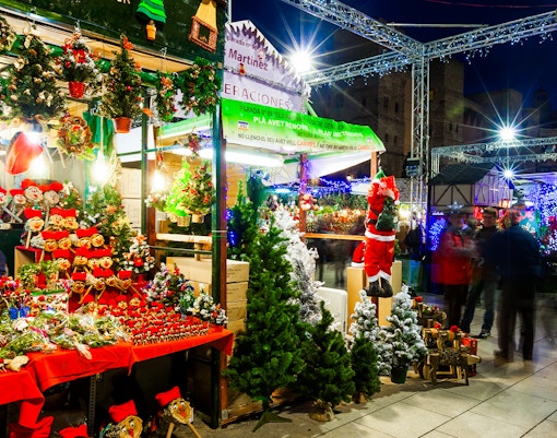 Stalls with Christmas decorations and trees at Fira de Santa Llúcia, Barcelona Christmas Market.