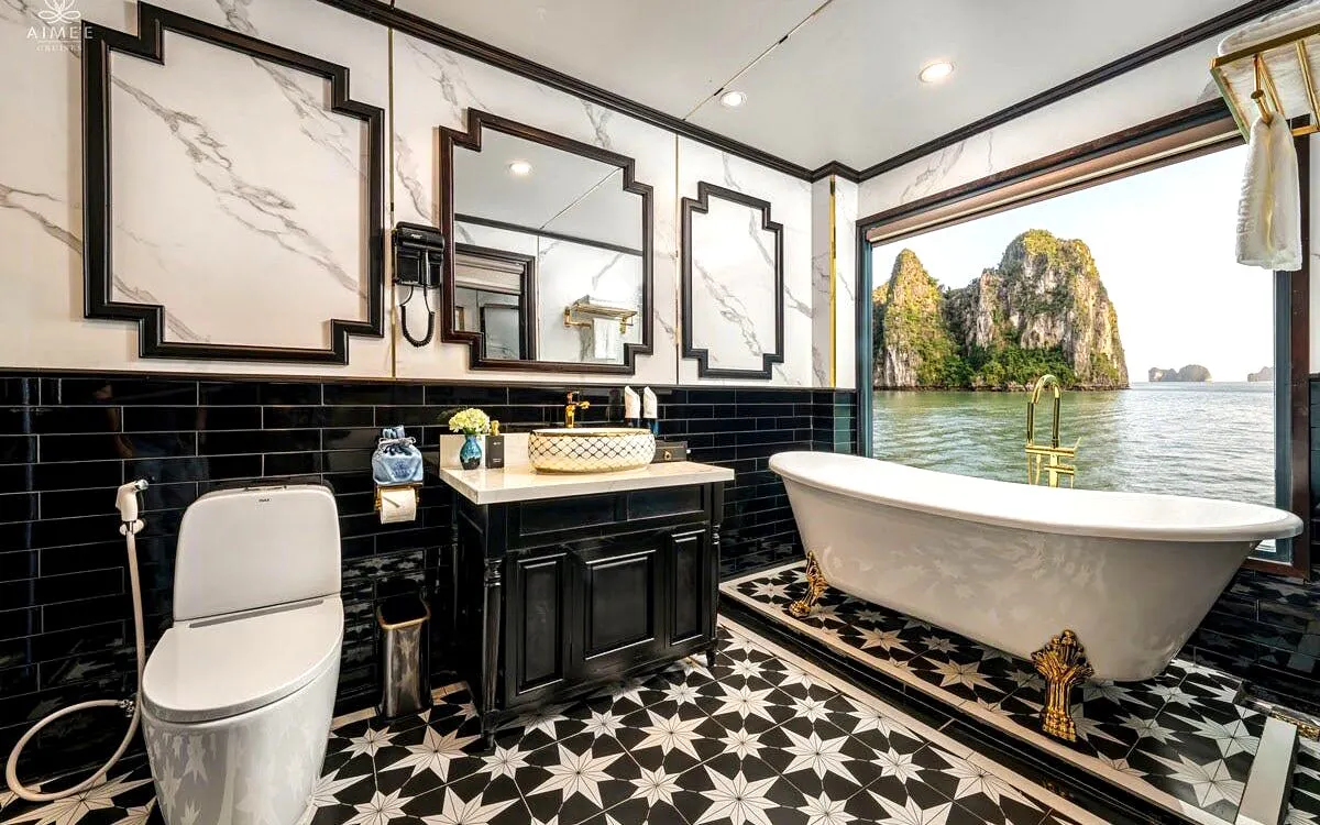 Luxurious bathroom with ocean view from Grace Ocean Suite on Ha Long Bay 5-Star Premium Cruise.