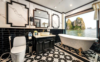 Luxurious bathroom with ocean view from Grace Ocean Suite on Ha Long Bay 5-Star Premium Cruise.