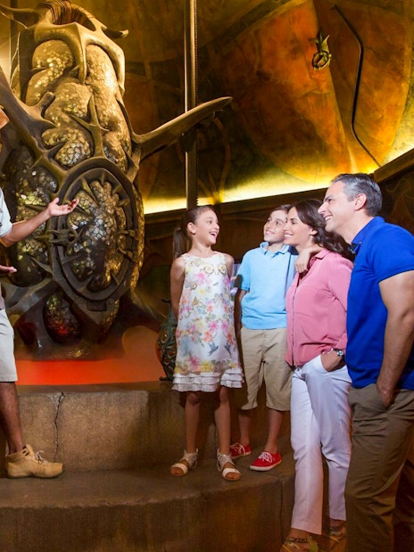 Guide explaining exhibit to family at The Lost Chambers Aquarium.