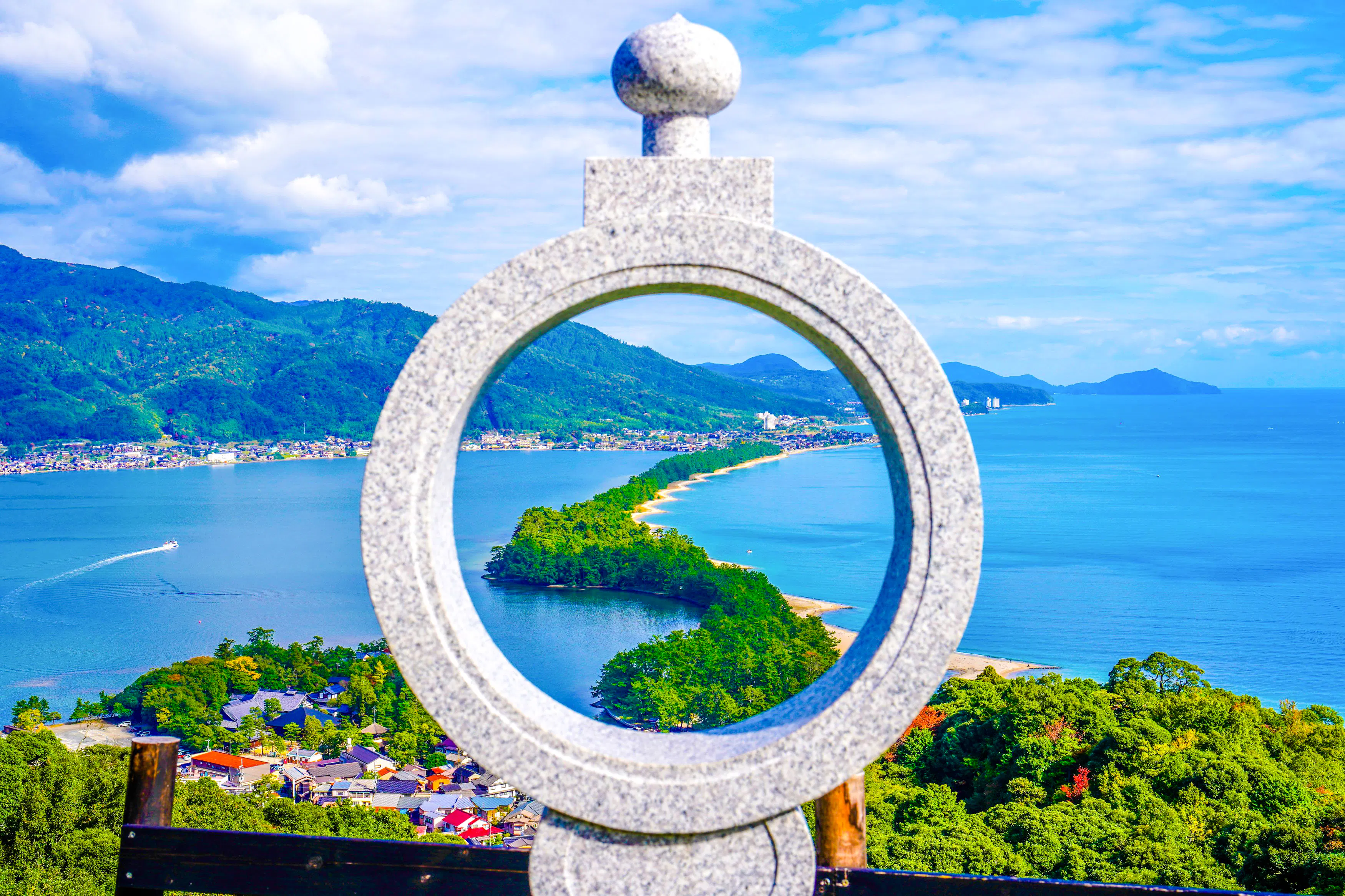 Amanohashidate sandbar view through stone circle, Kyoto Prefecture, Japan.