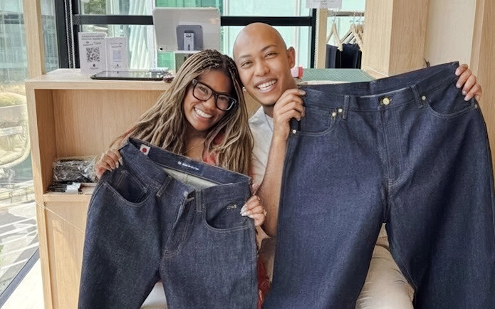 Couple showcasing handmade jeans at Harajuku Tokyo Denim Jeans Making Experience.