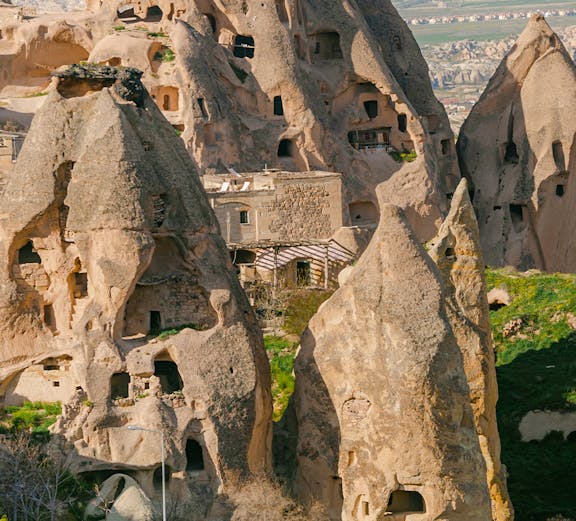 Rock formations with carved dwellings at Derinkuyu Underground City, Cappadocia, Turkey.