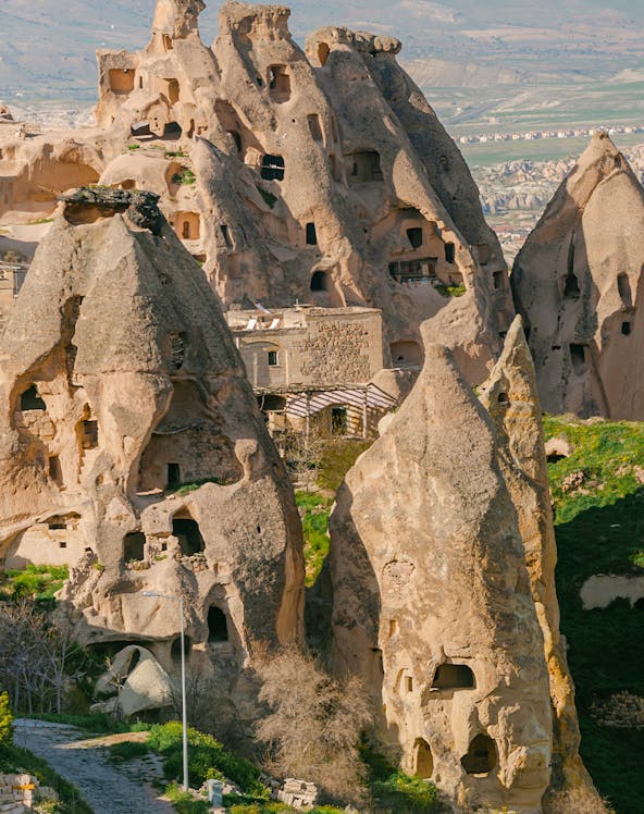 Rock formations with carved dwellings at Derinkuyu Underground City, Cappadocia, Turkey.