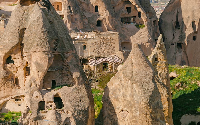 Rock formations with carved dwellings at Derinkuyu Underground City, Cappadocia, Turkey.