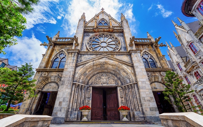St Denis Church facade with ornate carvings, Ba Na Hills, Vietnam.