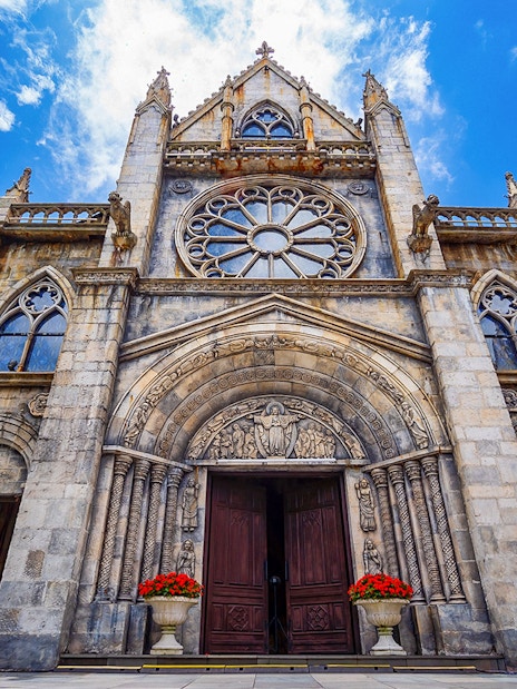 St Denis Church facade with ornate carvings, Ba Na Hills, Vietnam.