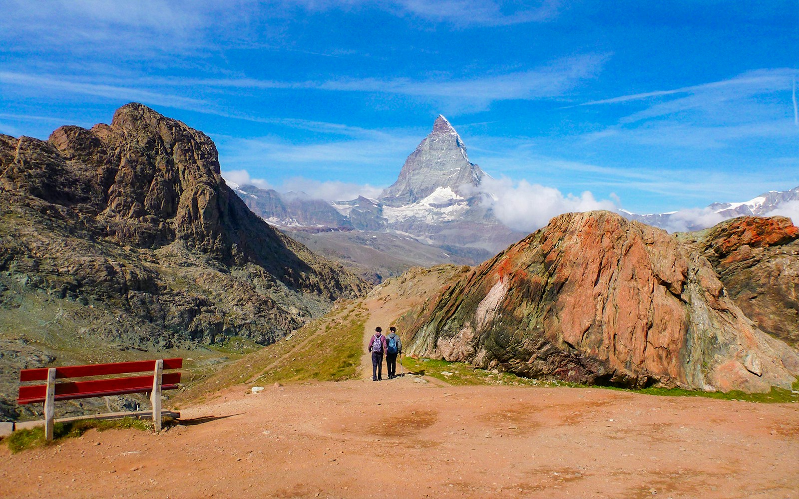 Hikers on a trail with the Matterhorn in the background, Rotenboden, Switzerland.