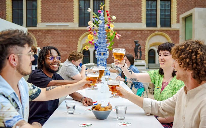 Visitors enjoying beverages at Rijks café, Amsterdam.
