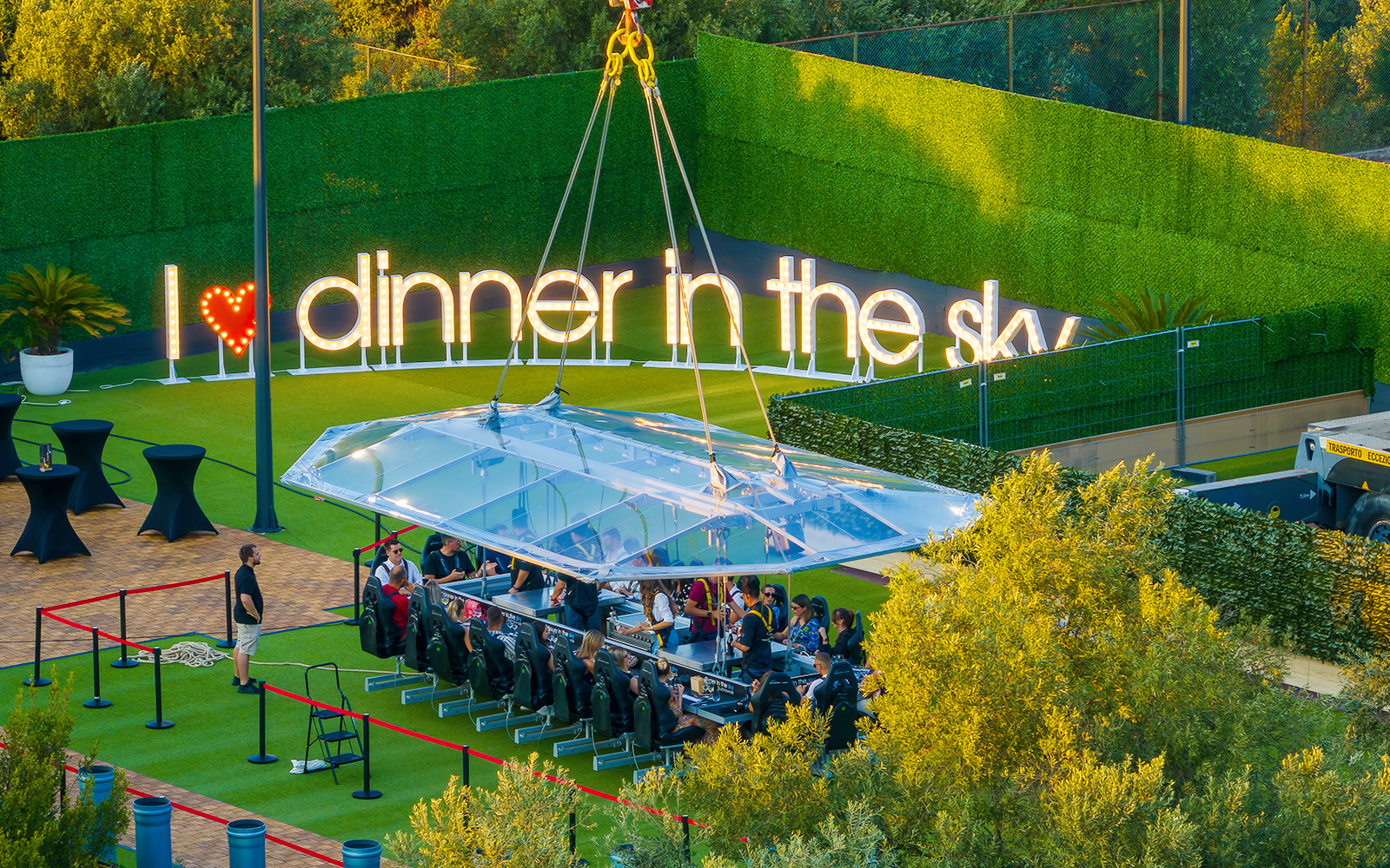 Guests dining at suspended table, Dinner in the Sky, Dubrovnik.