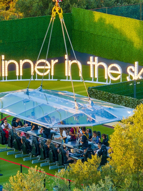Guests dining at suspended table, Dinner in the Sky, Dubrovnik.