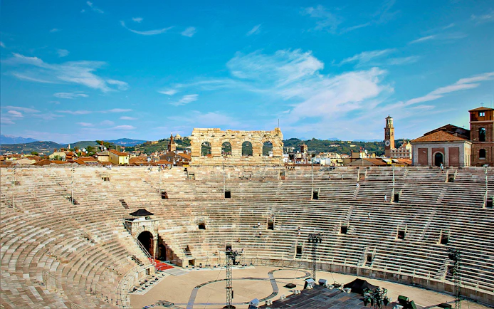 Verona Arena amphitheater with surrounding cityscape in Verona, Italy.