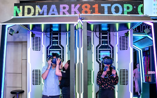 Virtual reality experience at Landmark 81 with visitors using VR headsets.