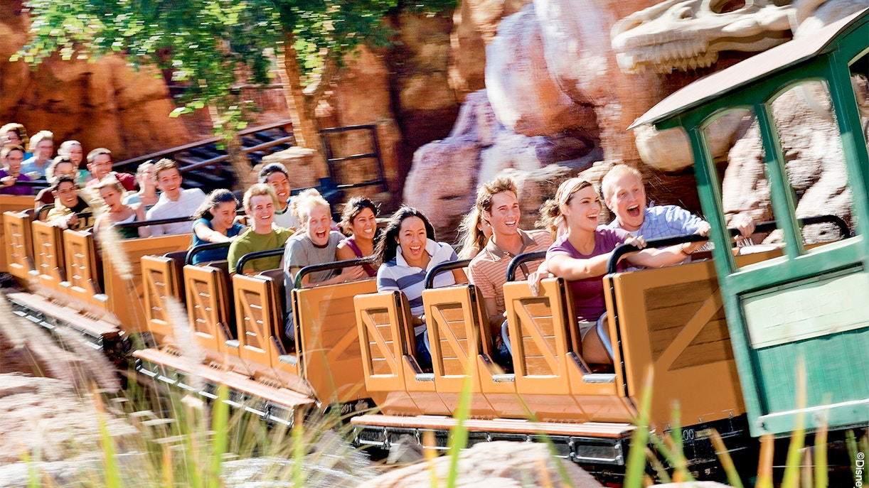 Visitors enjoying a roller coaster ride at Frontierland, Disneyland Park, California.