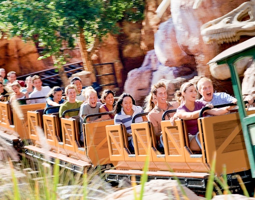 Visitors enjoying a roller coaster ride at Frontierland, Disneyland Park, California.
