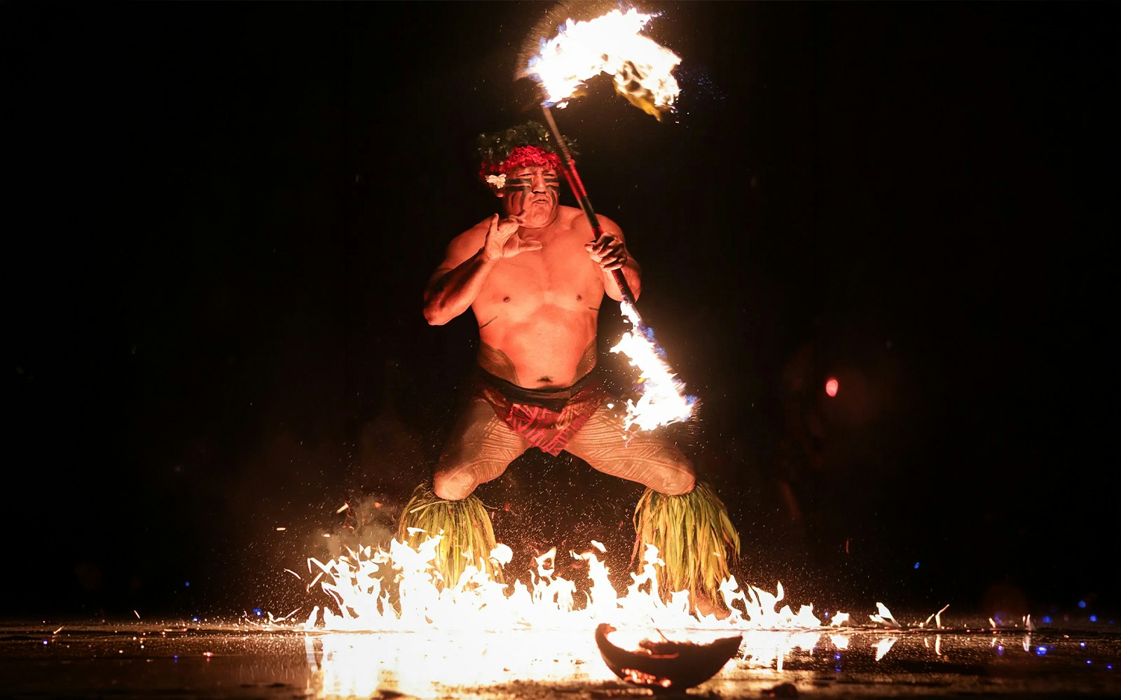 Fire dancer performing at Chief's Luau, Oahu, Hawaii.