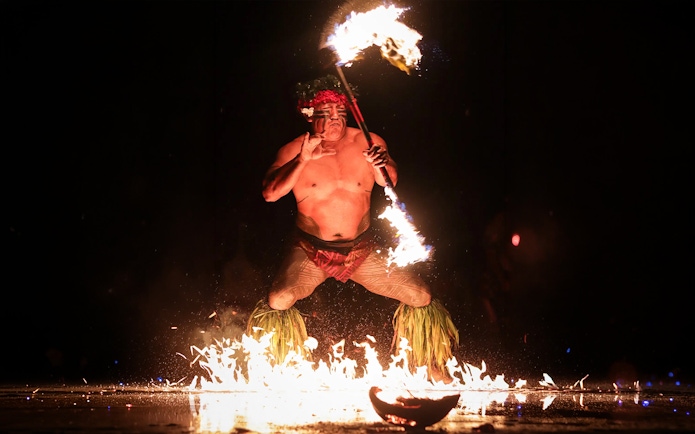 Fire dancer performing at Chief's Luau, Oahu, Hawaii.