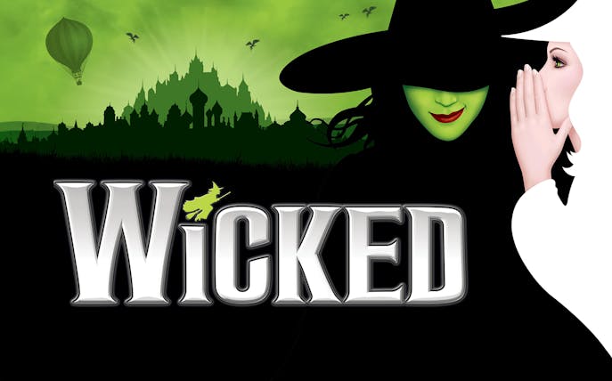 WICKED the Musical logo with green witch and city skyline.