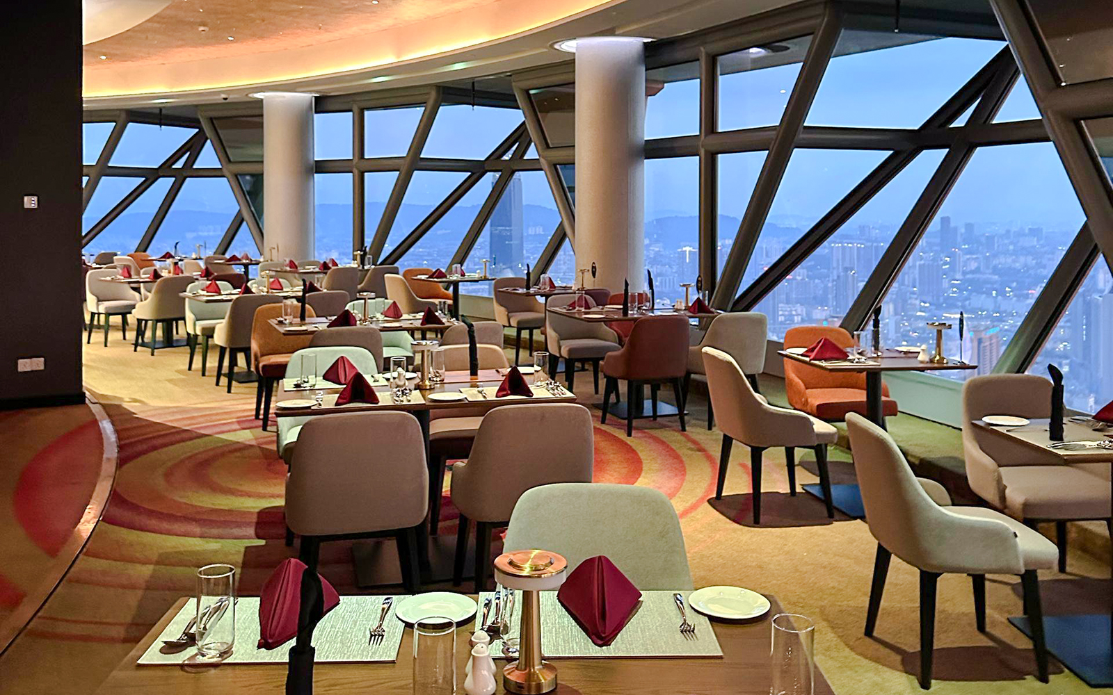 Lunch buffet setup at ORBIT Revolving Dining, KL Tower with city view.