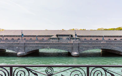 Niagara Power Station exterior with arched bridge over water.