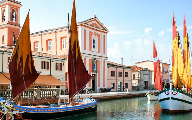 Sailboats on the canal near the Maritime Museum in Cesenatico, Italy.