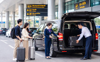 Travelers using Noi Bai Airport fast track service in Hanoi, luggage being loaded into a van.