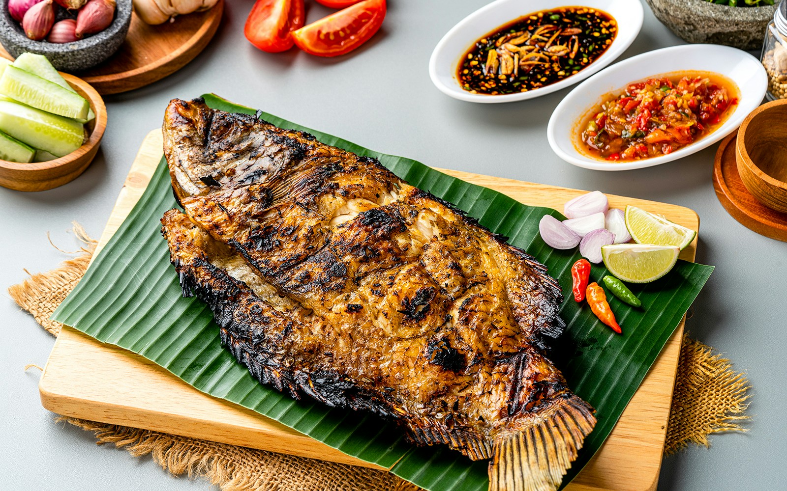Grilled fish on banana leaf with sambal sauce in Bali, Indonesia.