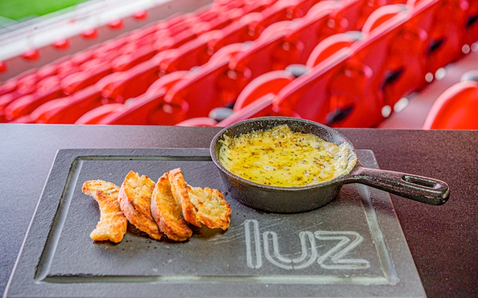 Cheese fondue with bread at Benfica Stadium restaurant, Lisbon.
