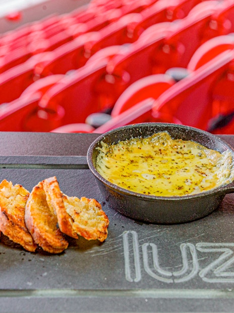 Cheese fondue with bread at Benfica Stadium restaurant, Lisbon.
