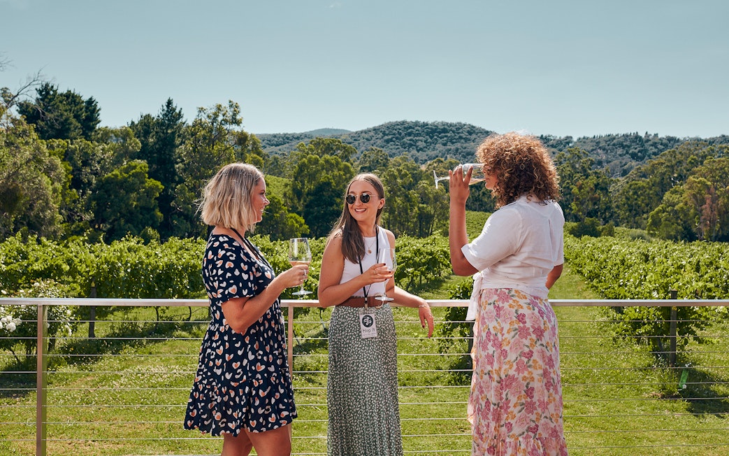 Women enjoying wine at a vineyard in Yarra Valley, Melbourne.